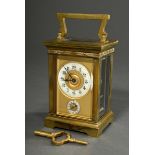 Travel alarm clock in brass case with faceted glass on all sides and crossband frieze, enamelled ch