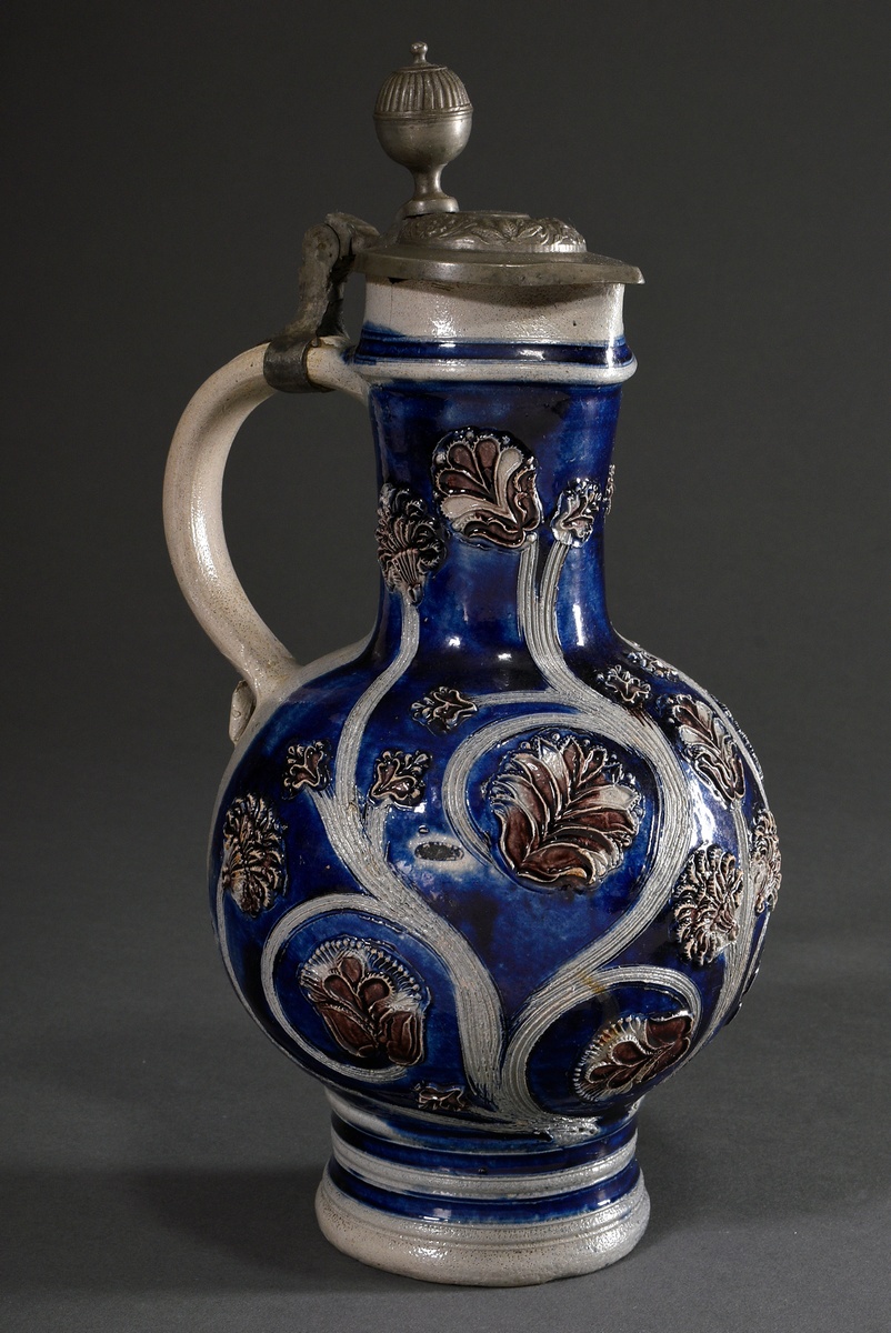 A baluster-shaped Westerwald tankard with semi-plastic floral ornaments and a wide strap handle cur - Image 2 of 8