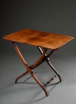 Mahogany patent travelling table with folding top over beautifully curved legs with turned bar conn