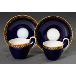 2 Various KPM moch cups/saucers in Campanian form with relief gold border on cobalt blue background