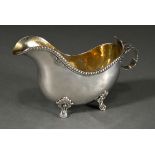 Small butter sauce boat with martelised body on 4 feet with beaded rim and leaf handle, Sweden, 1st