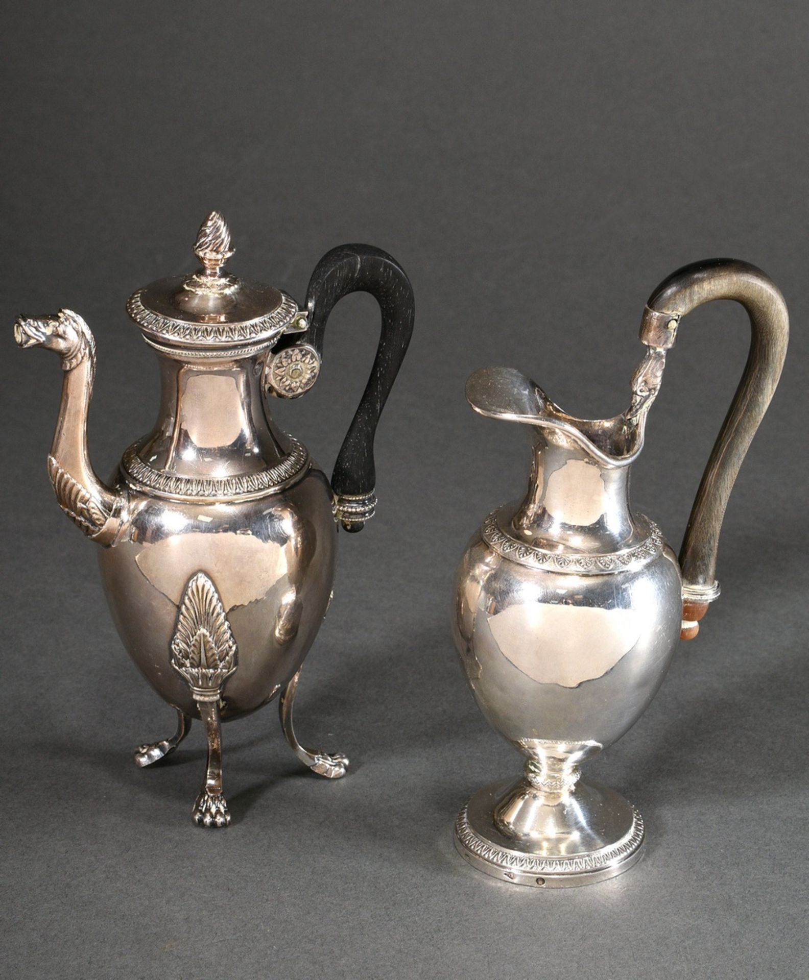 2 Small French jugs with classical ornamental and foliate frieze and wood and horn handles, 1x with