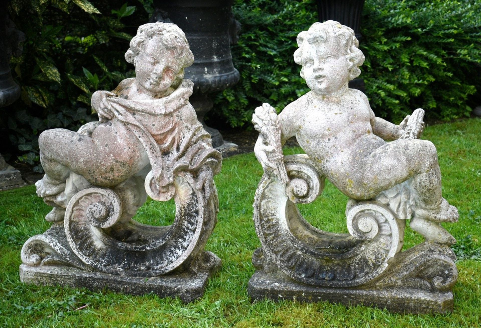Pair of sandstone garden figures "Putti Allegories Summer and Winter", 75x53x28, traces of weatheri
