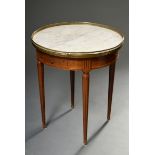 Round mahogany side table in classicist style with white marble top and surrounding brass gallery o