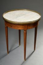 Round mahogany side table in classicist style with white marble top and surrounding brass gallery o