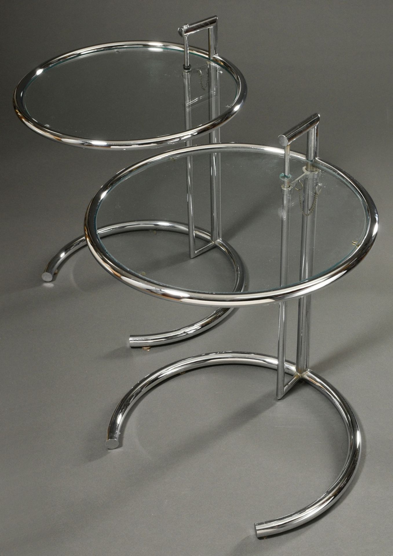 Pair of side tables "E 1027", design by Eileen Gray in 1925, tubular steel and glass, height-adjust
