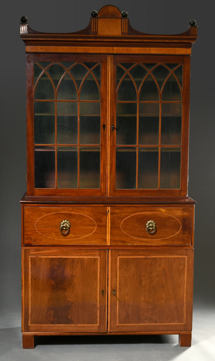 Top-mounted chest of drawers in austere façon with pointed arch bracing over green glass, upper dra