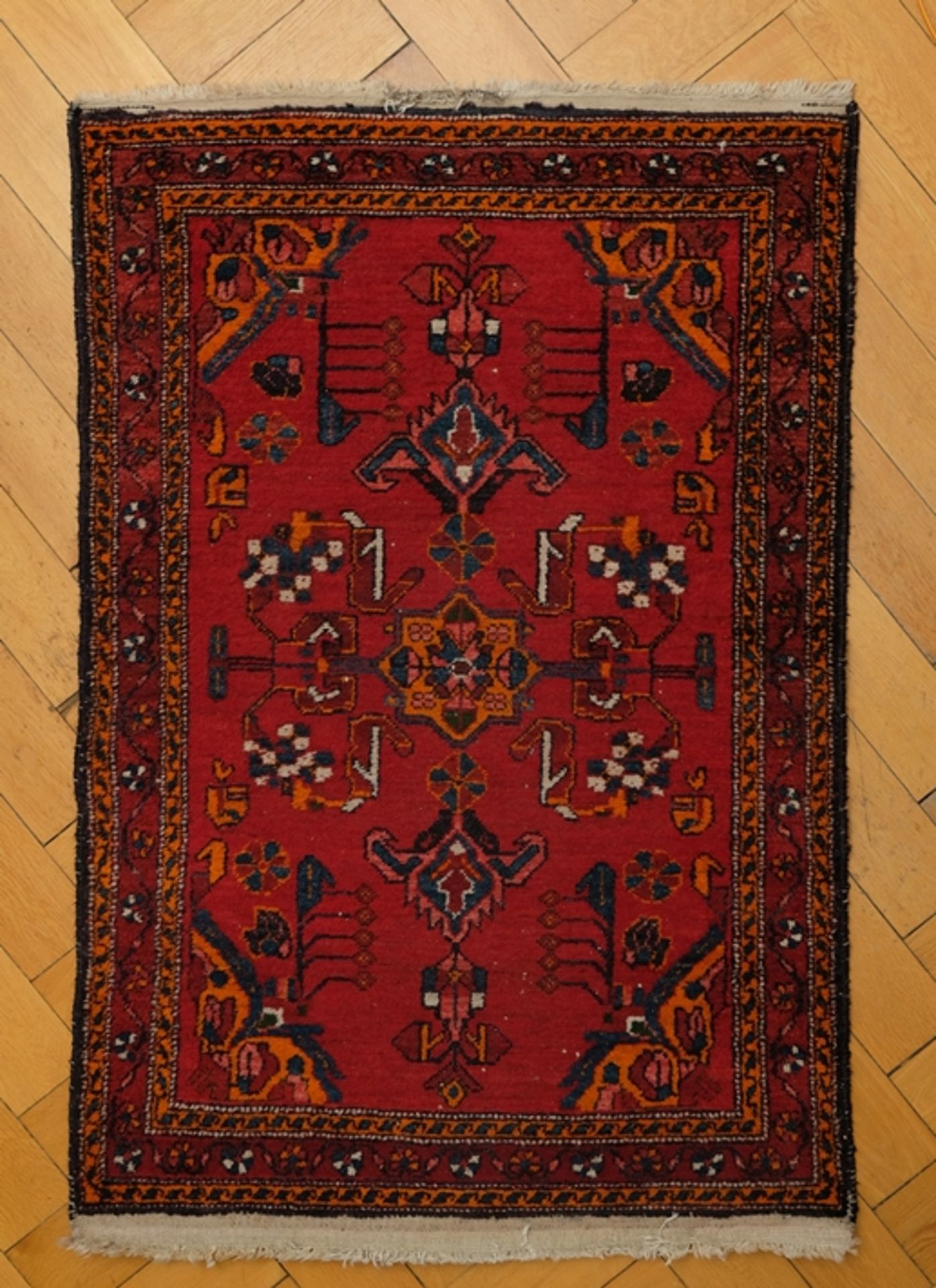 Vintage carpet in the style of a Caucasian Shirvan, circa 1980.