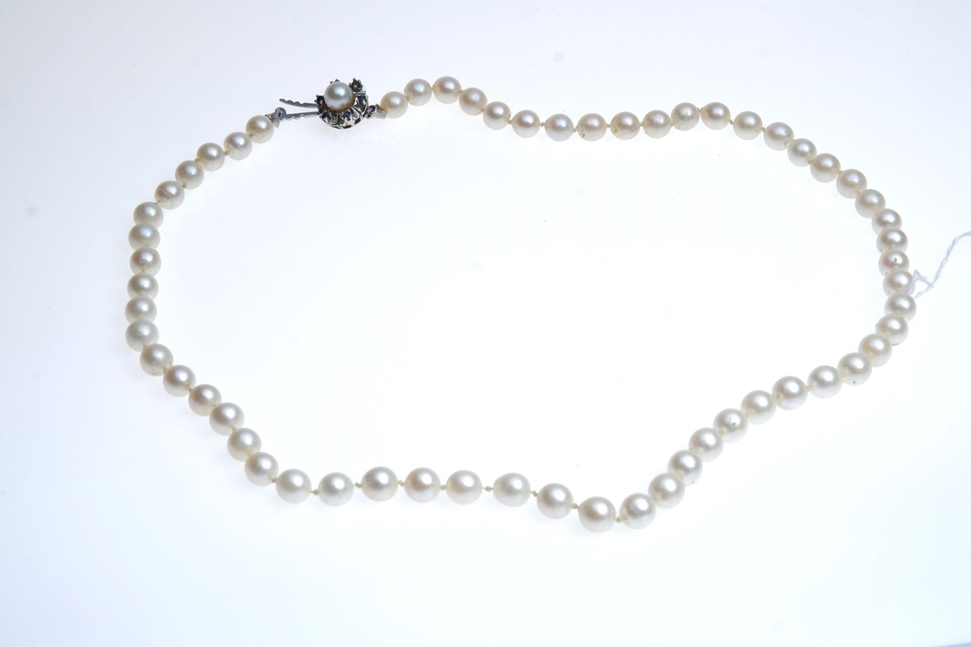 Pearl necklace, over 60 pearls, individually knotted, 585 white gold clasp, hallmarked, set with pe