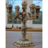 Art Nouveau candlestick, five-flame, richly floral decorated, rocailles and foliage, curved base. 9
