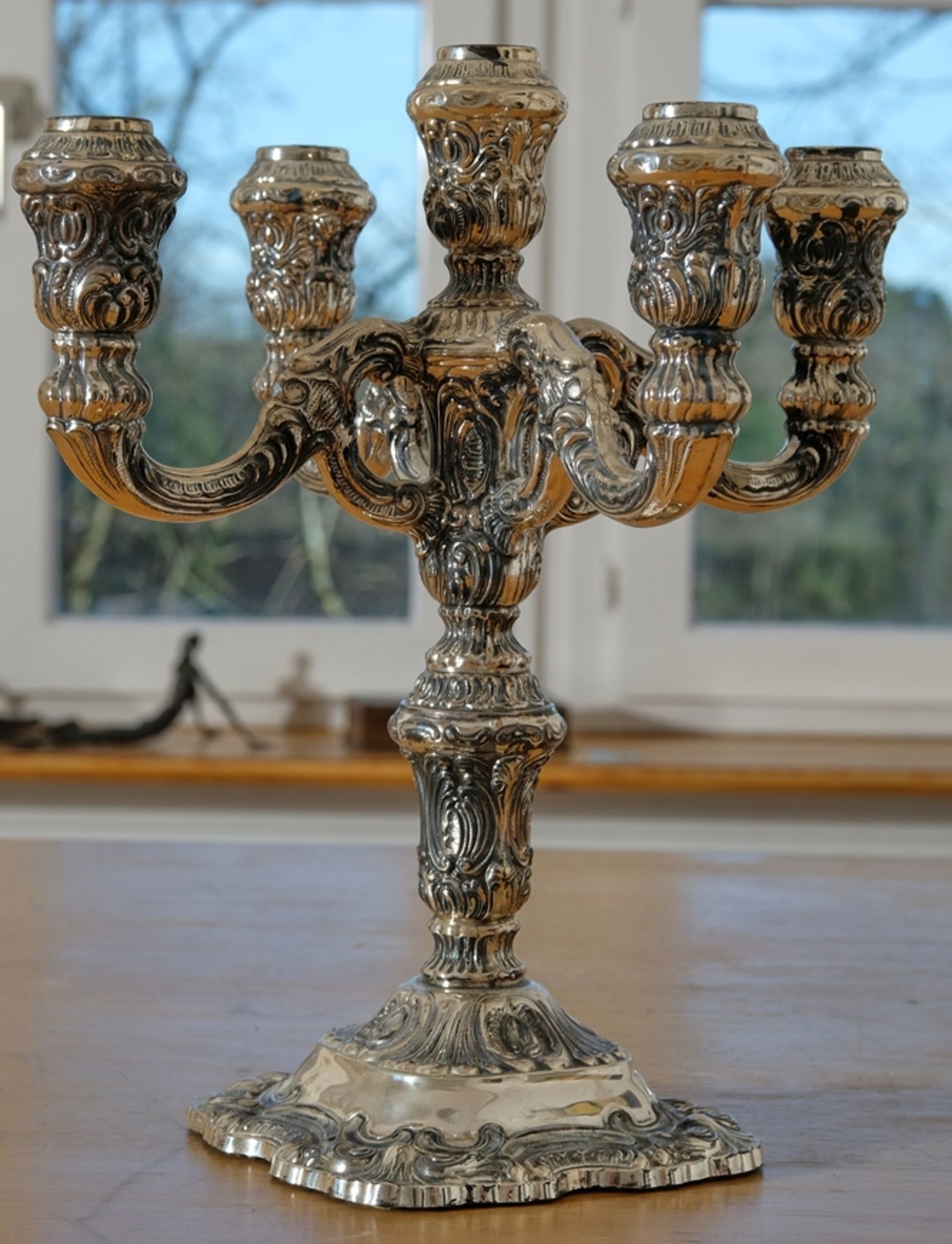 Art Nouveau candlestick, five-flame, richly floral decorated, rocailles and foliage, curved base. 9