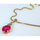 Ruby pendant on a fine gold chain, ruby set in eight fine prongs, setting with three small pearls. 