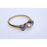 Gold ring with pearl and diamonds, 585 GG, 0.23 ct, size 53. Two diamonds, each 0.23 ct, set with a