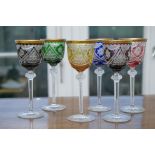 Six champagne goblets, flashed glass (lead glass) and gold rim, as well as nodus with pointed stone