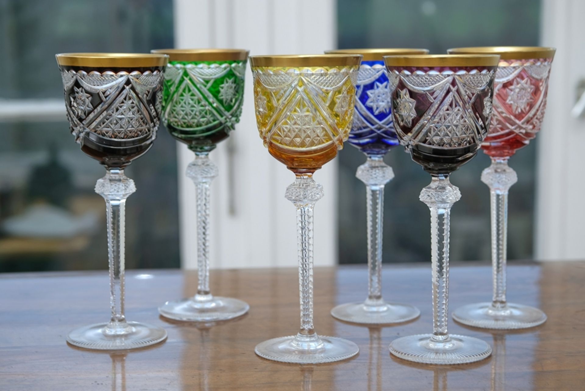 Six champagne goblets, flashed glass (lead glass) and gold rim, as well as nodus with pointed stone