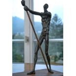Martin, Roland (born 1927) Standing male nude with pole, on thin plinth.
