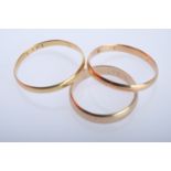 Three fine gold rings, size 62/61/55, yellow gold 333 (tested), together 4.86g