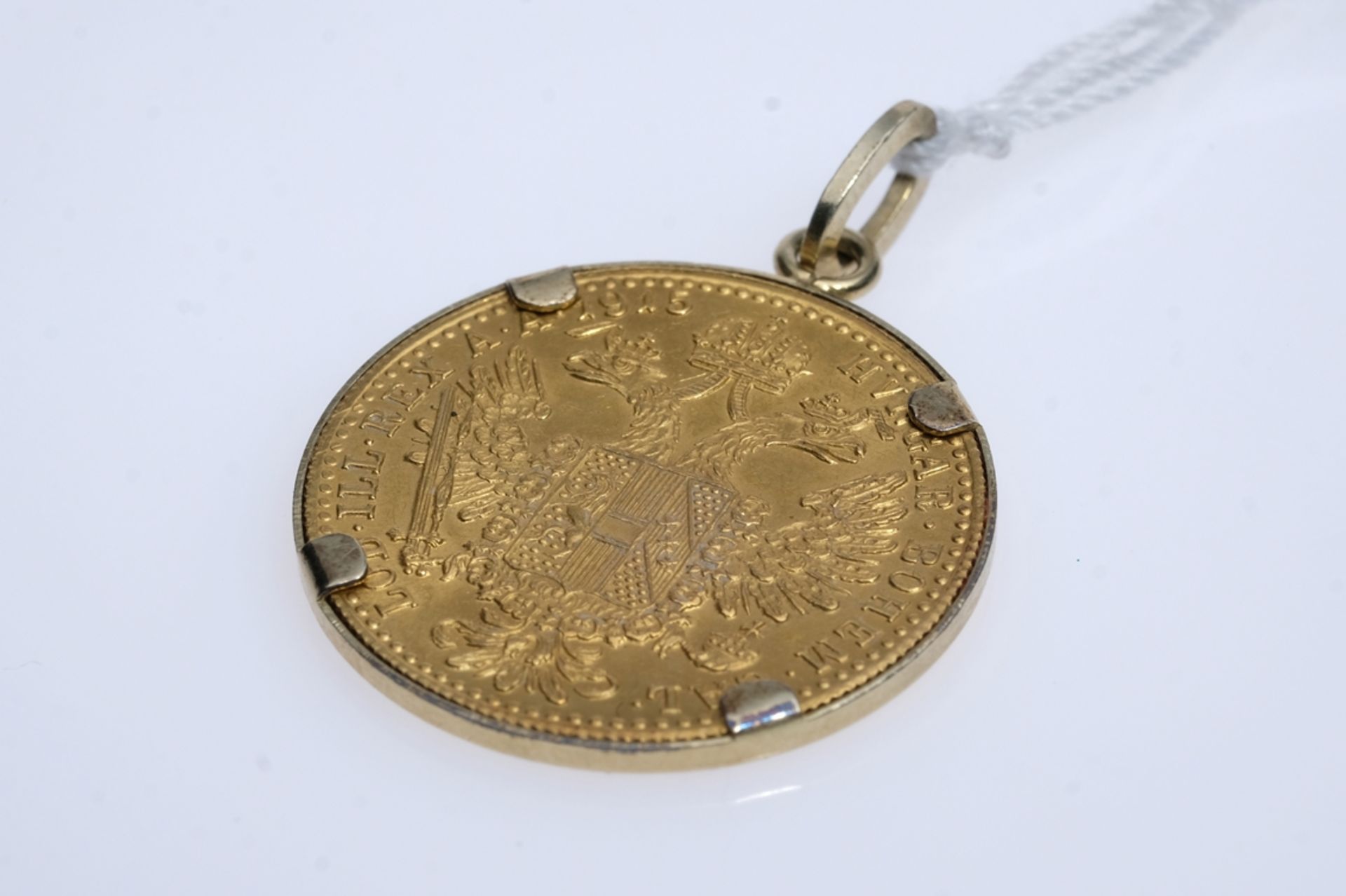 coin pendant with a ducat, pendant includes the attached ducat with four claws, ducat depicts the A