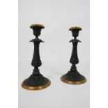 Pair of candlesticks, made of die-cast zinc, around 1870. Blackened with brass ring around the base