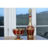 Art glass Ernst Wittig: Carafe and footed bowl made of ruby glass with gold painting.