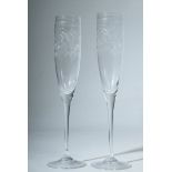 Two champagne flutes with engraved floral pattern, height 28cm