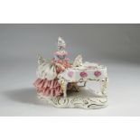 Porcelain figure, lady with a sweeping tulle dress on a wing, painted with roses. 