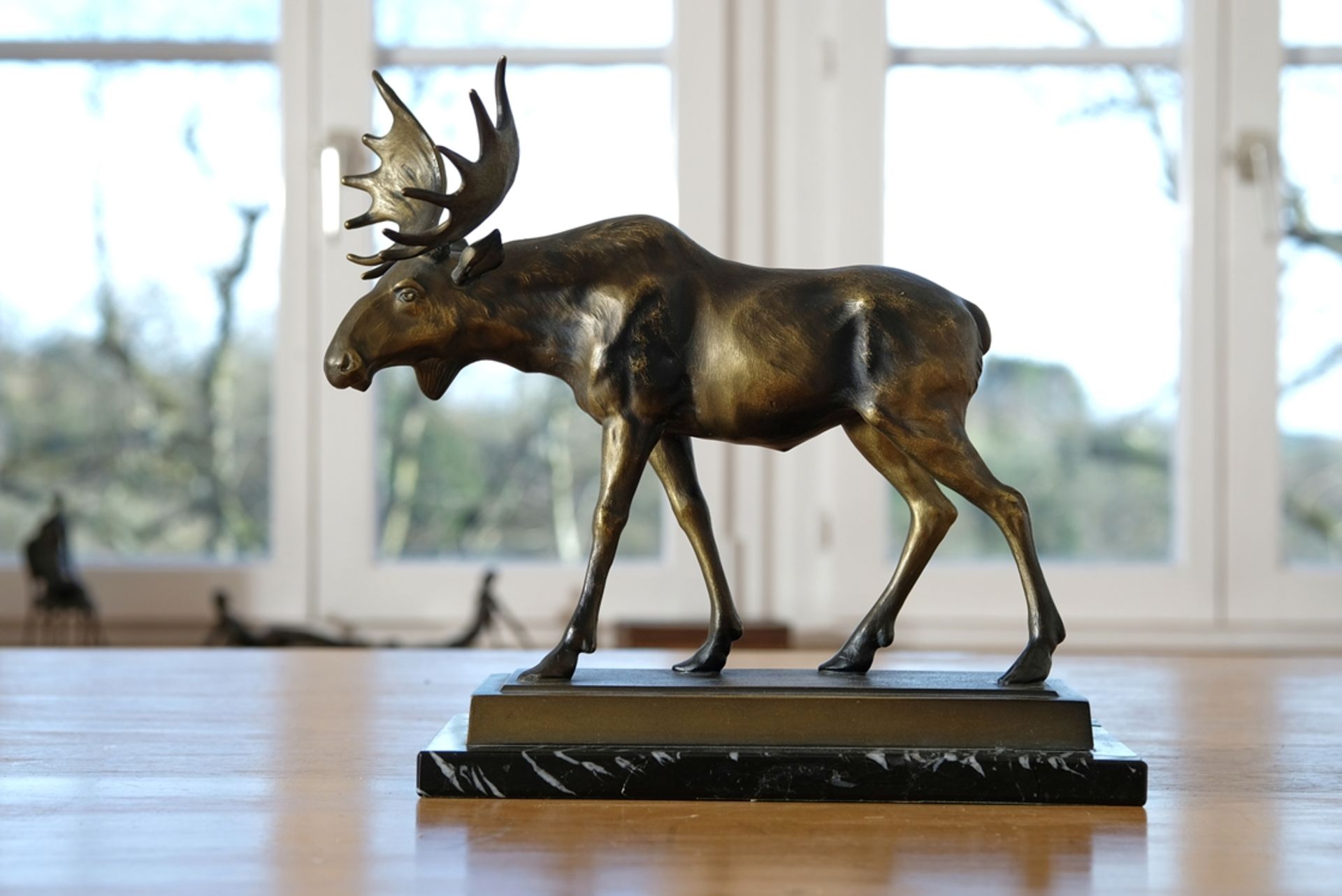 Keck, H.W. (Kreuzlingen), Moose with large antlers, standing, bronze, on plinth.