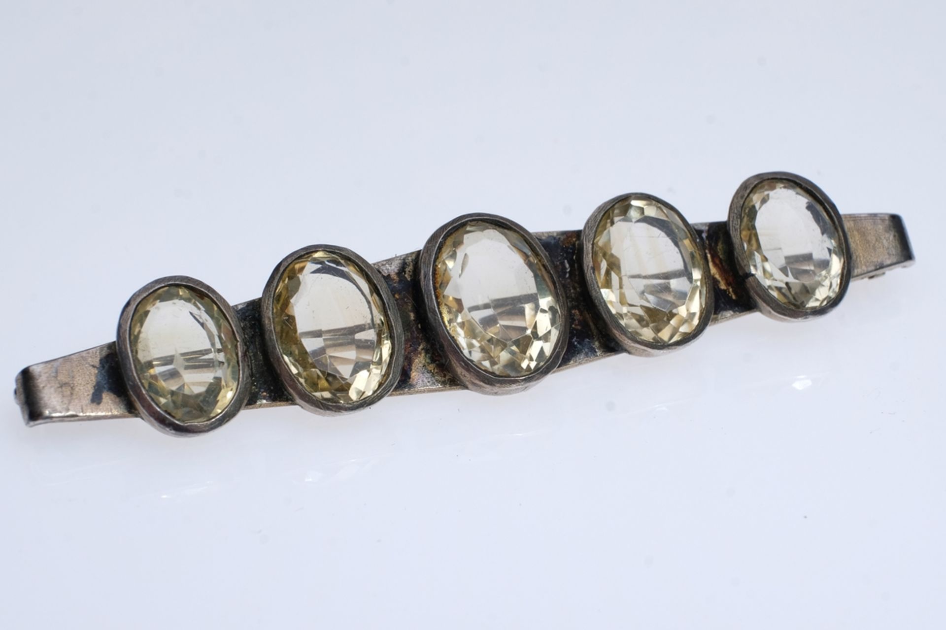 Brooch set with five gemstones, probably rock crystal, cut, oval setting, costume jewellery, length