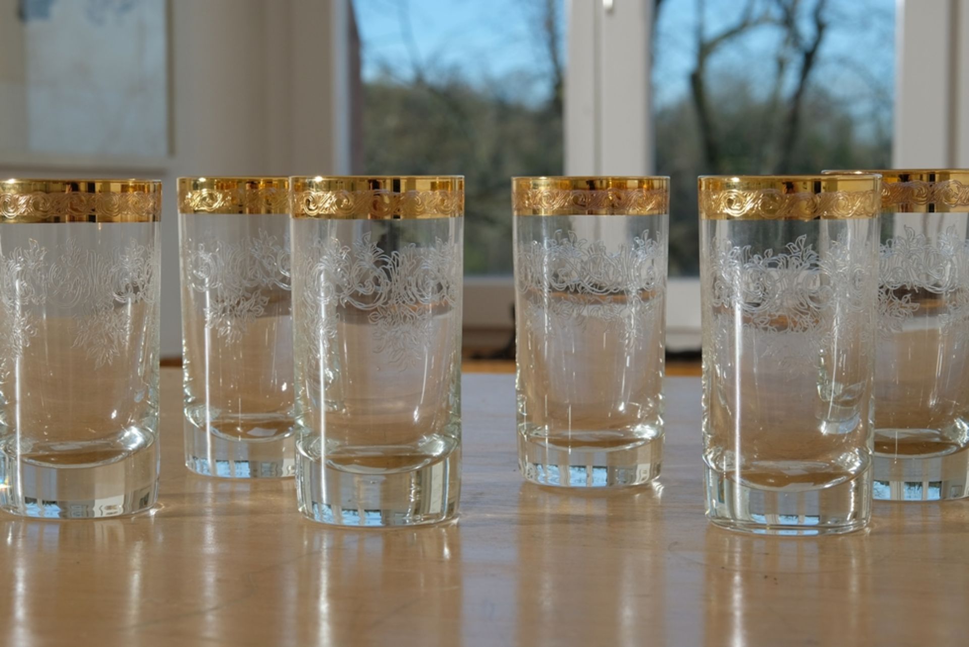 Murano Medici gold rim, six long drink glasses, crystal glass engraved with plant motifs.