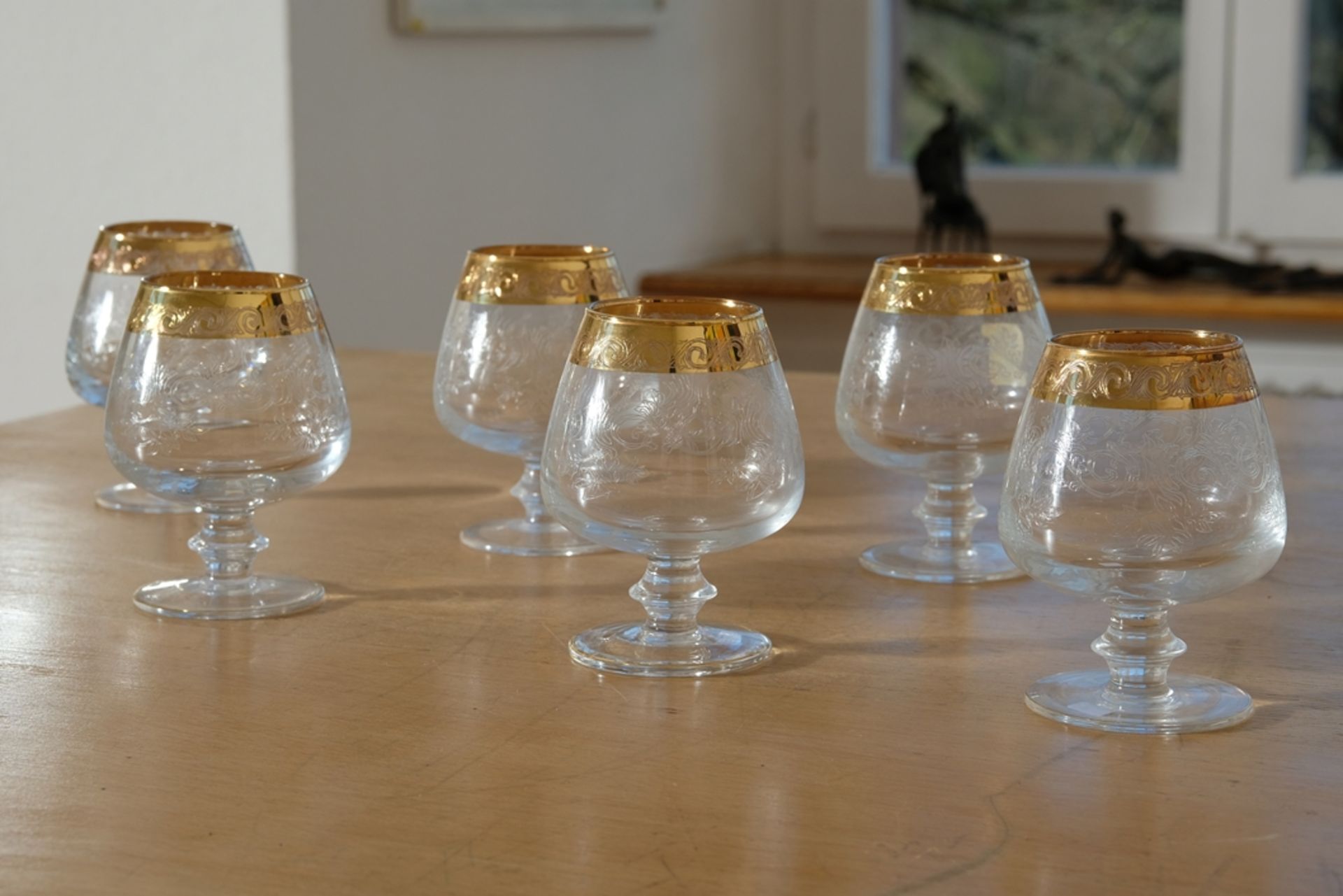 Murano Medici gold rim, six cognac glasses, crystal glass engraved with plant motifs.