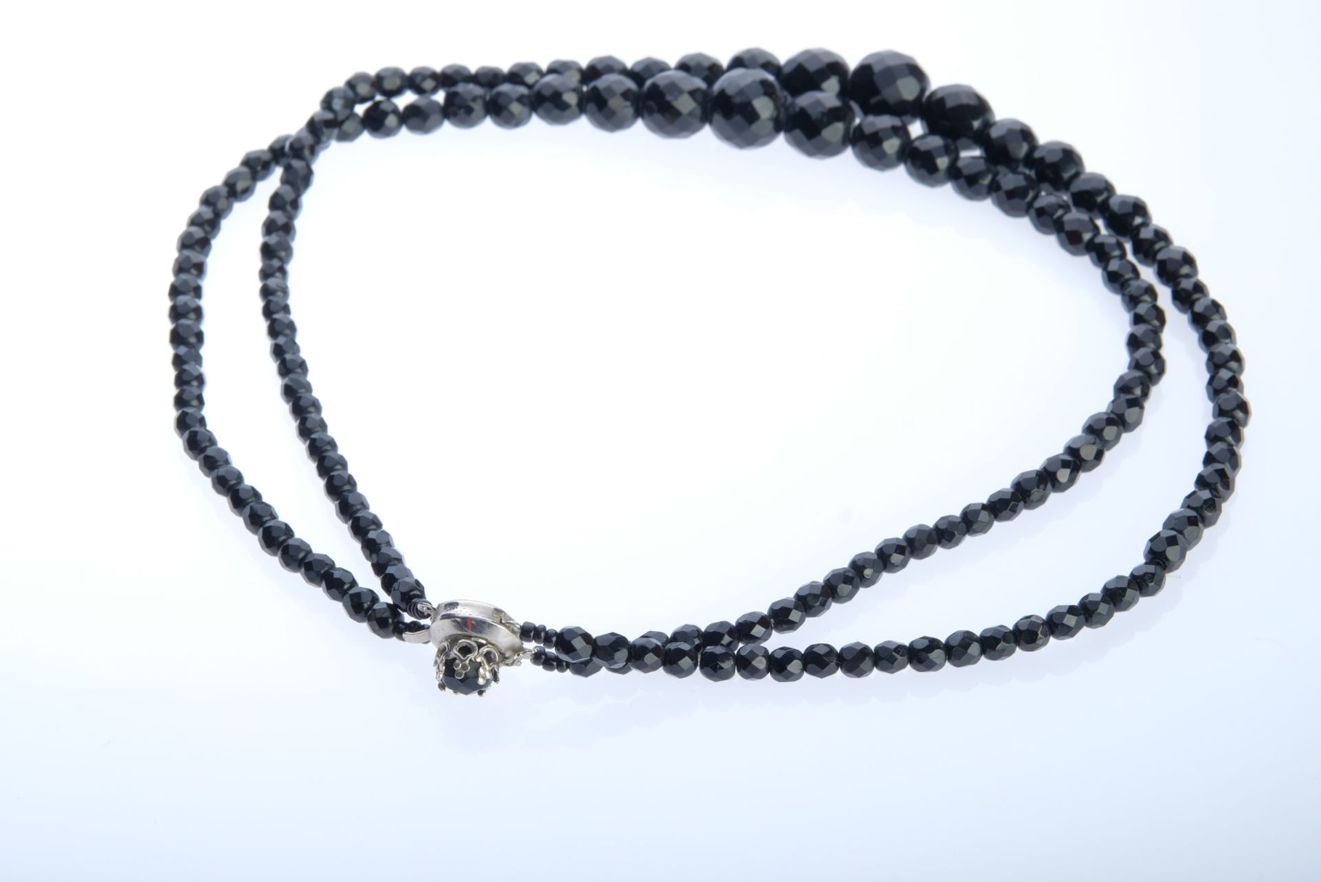 Necklace double-row, black faceted beads, D 5-15mm, pin fastener set with another bead, length 45cm