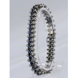 Streifenarmband mit 40 Saphiren, zusammen ca. 5 ct und 80 Brillanten, zusammen ca. 1,5 ct,