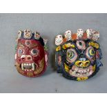 2 antike asiatische Wandmasken mit