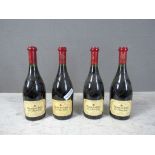 Vier Flaschen Rotwein