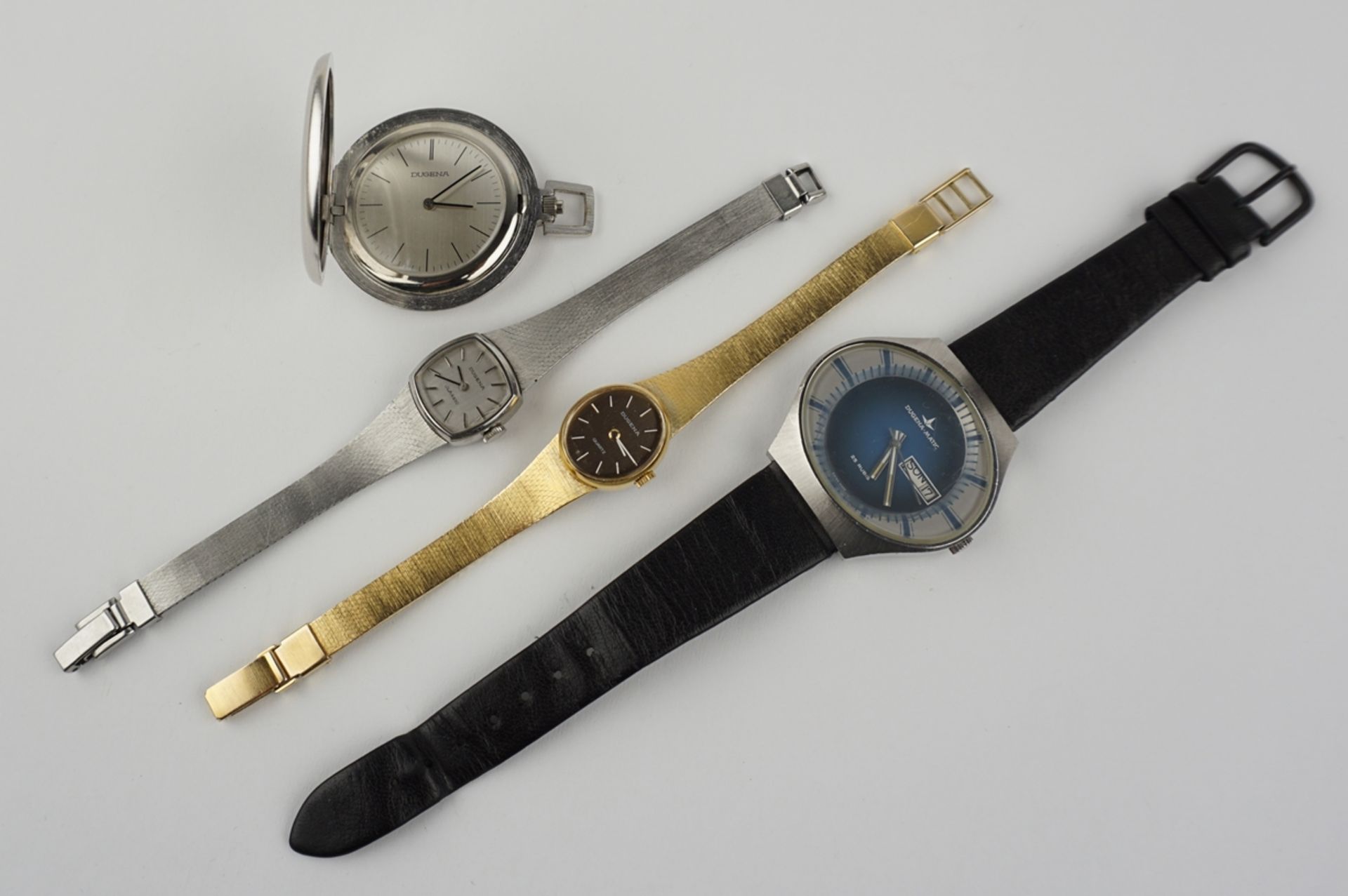 Konvolut Dugena: Taschenuhr, Herrenarmbanduhr und 2 Damenarmbanduhren, 1970er/1980er Jahre