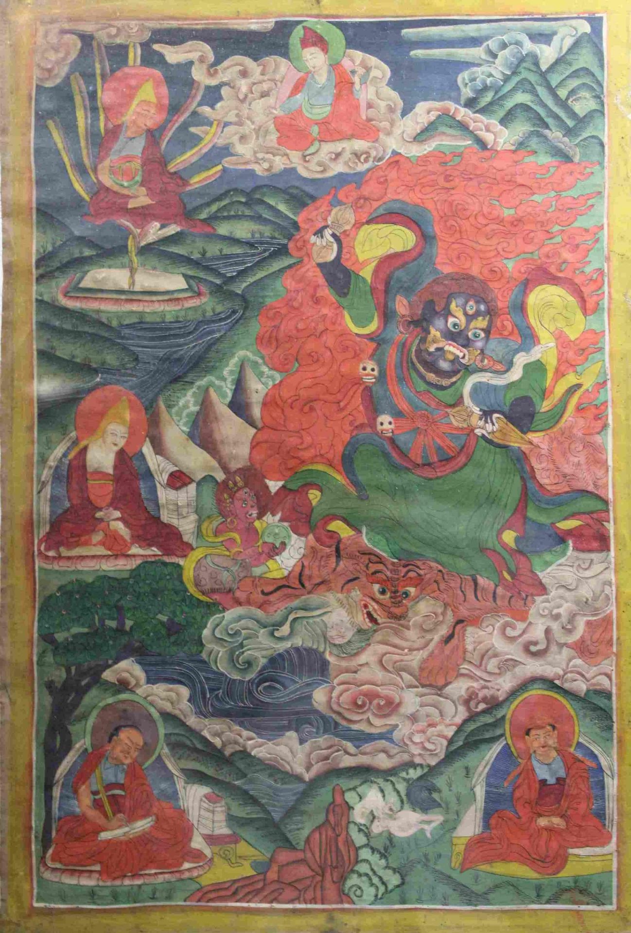 Thangka, Nepal 18.Jh., Gottheit mit drei Augen reitet auf Tiger in einer Flusslandschaft, umringt v