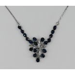 1 Collier WG 14ct., wohl mit Saphiren und kleinen Brillanten, min. Tsp.