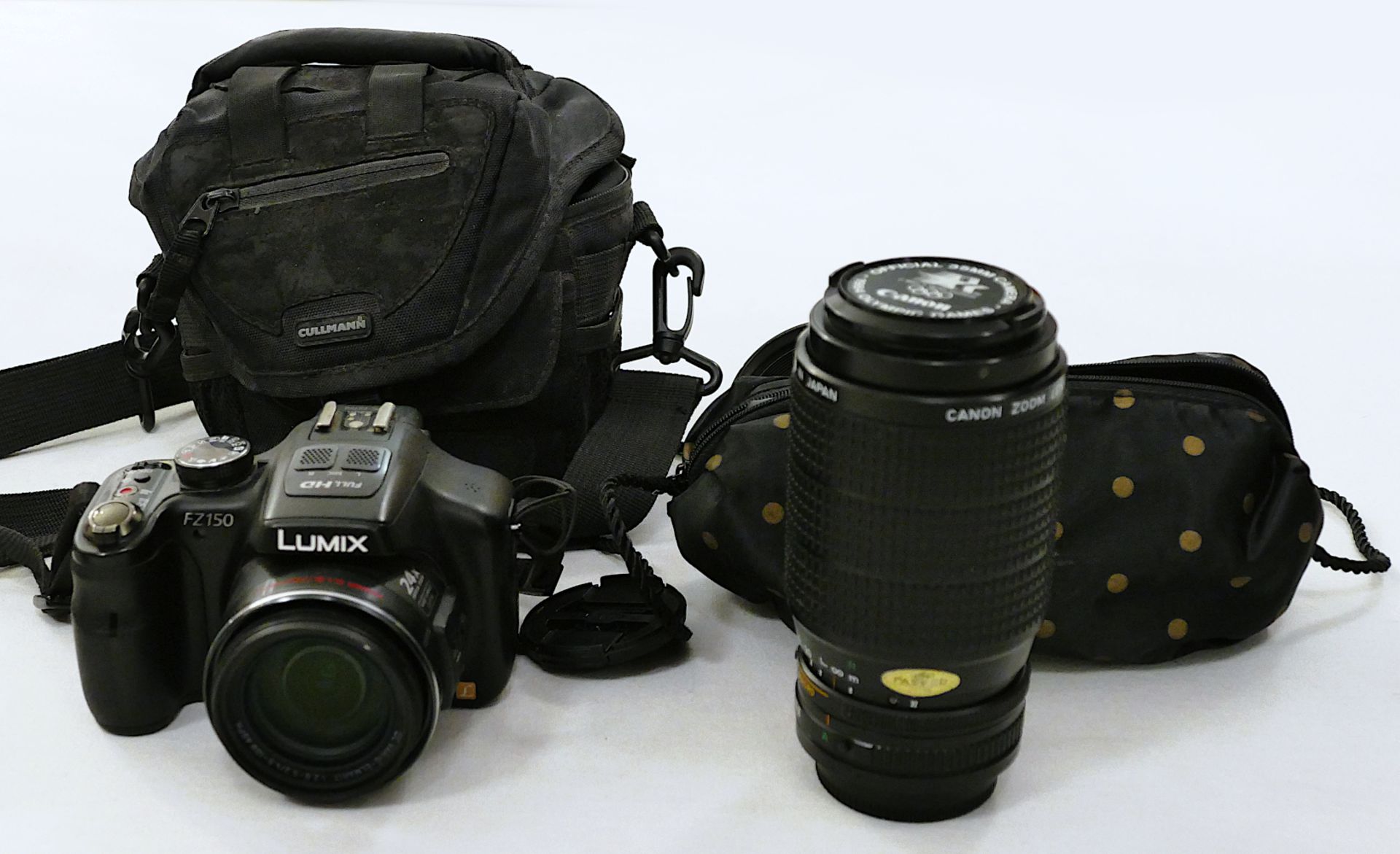 1 Fotoapparat LUMIX "FZ150" mit Objektiv CANON "FD 75-200mm 1:4,5" mit Tragetasche, u.a., Eigengeruc