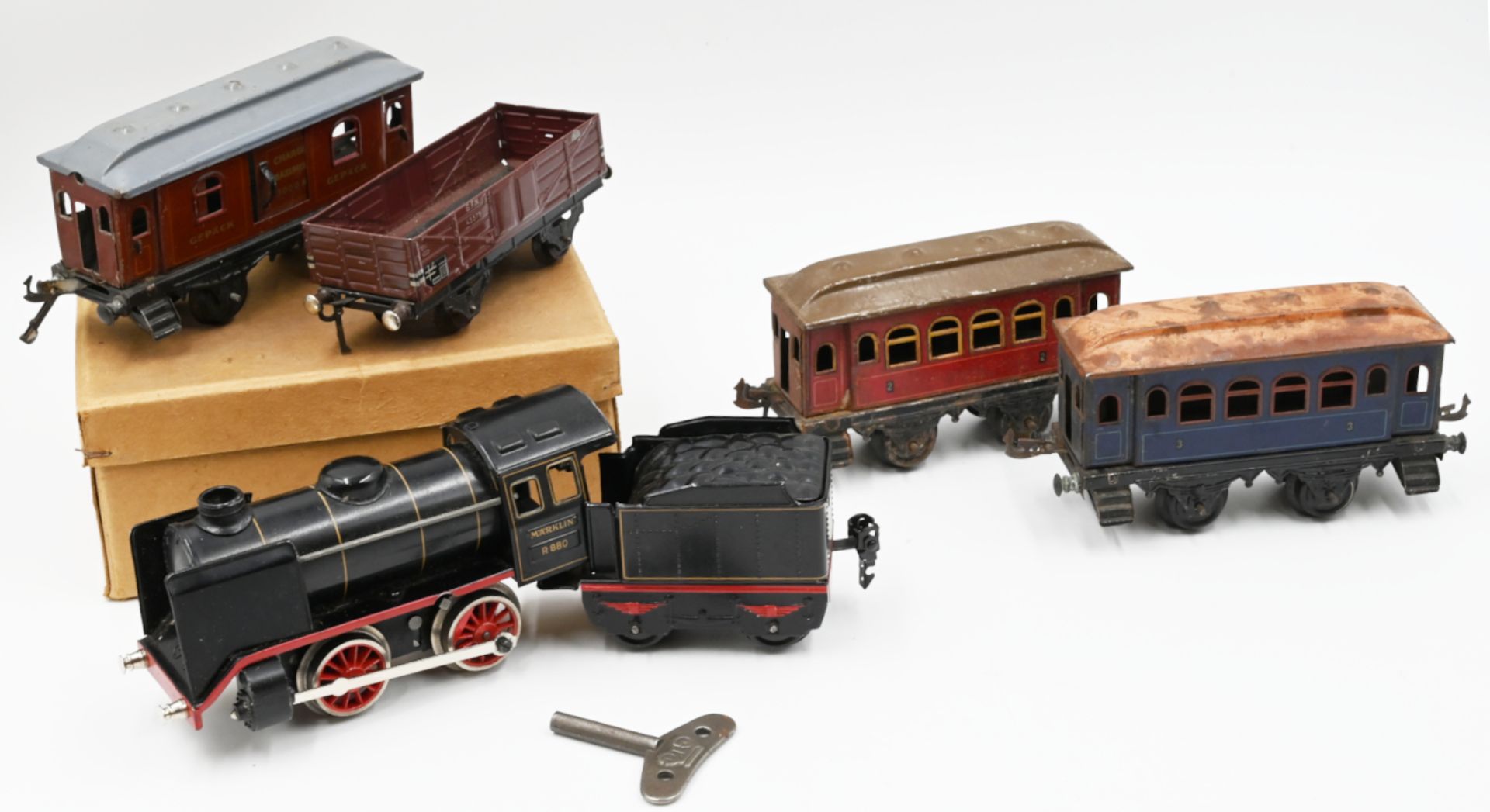 1 Konv. Modelleisenbahn: Dampflokomotive MÄRKLIN "R880" mit Uhrwerkantrieb, Tender,