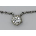 1 Collier wohl ungestempelt, wohl WG, mit Solitärbrillant ca. 0,3ct. (D. ca. 0,45cm), Tsp.