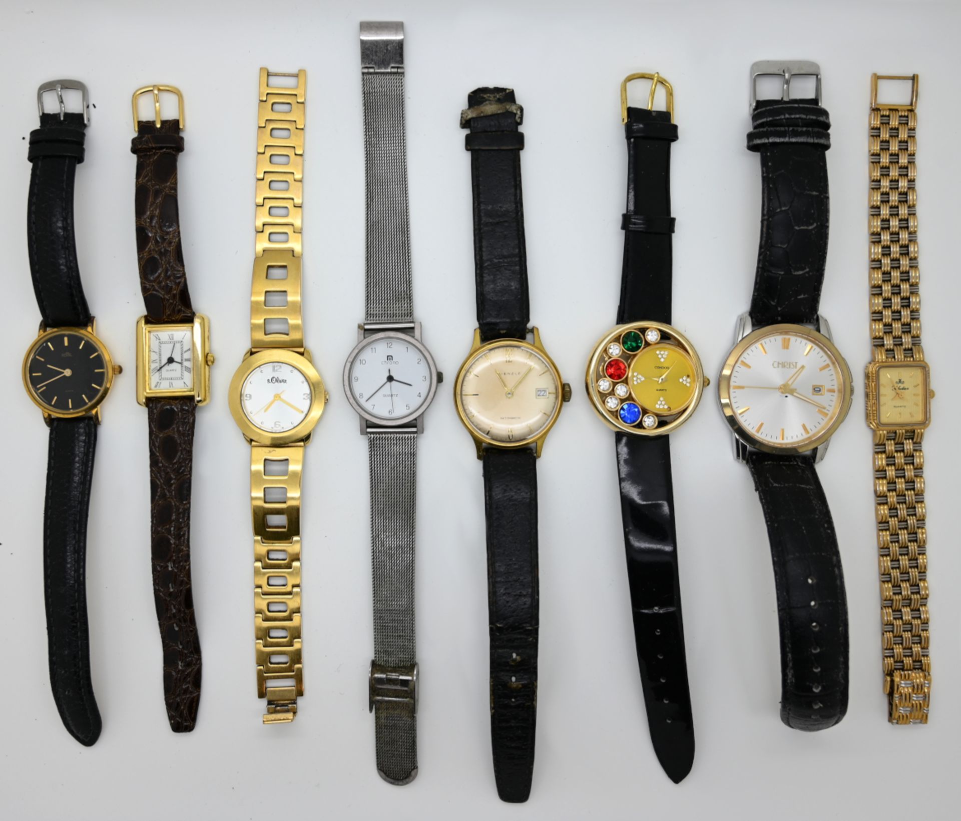 1 Konv. Armbanduhren u.a.: Metall u.a., z.T. mit Lederband, verschieden, je Asp./Tsp., in der Schatu