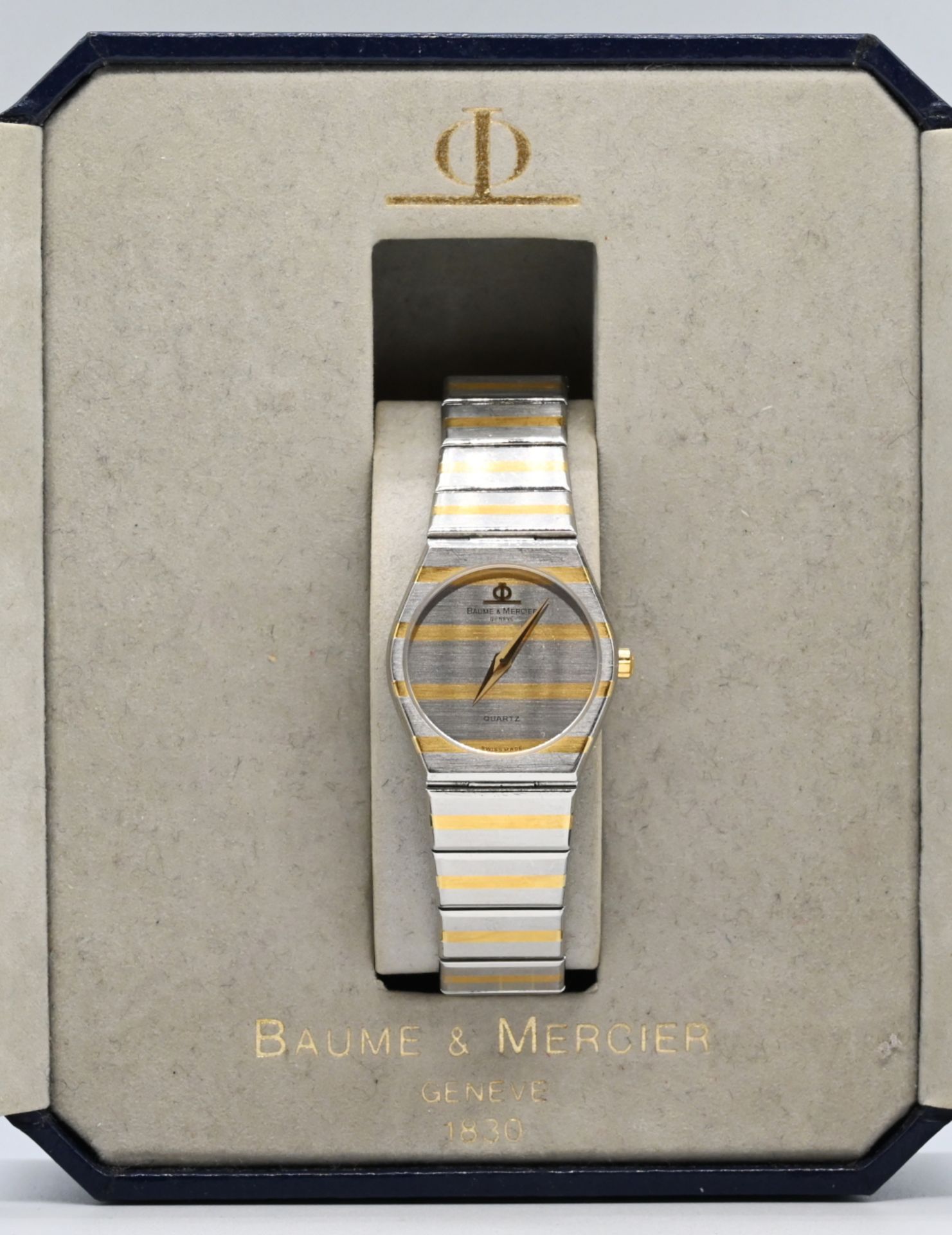 1 Damenarmbanduhr BAUME&MERCIER, Stahl Quarz, z.T. vergoldet, mit Anleitung und Originalschatulle, T