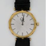 1 Armbanduhr GG 18ct., GM, mit kleinen Brillanten an der Seite, Durchmesser ca. 3,1cm, mit schwarzem