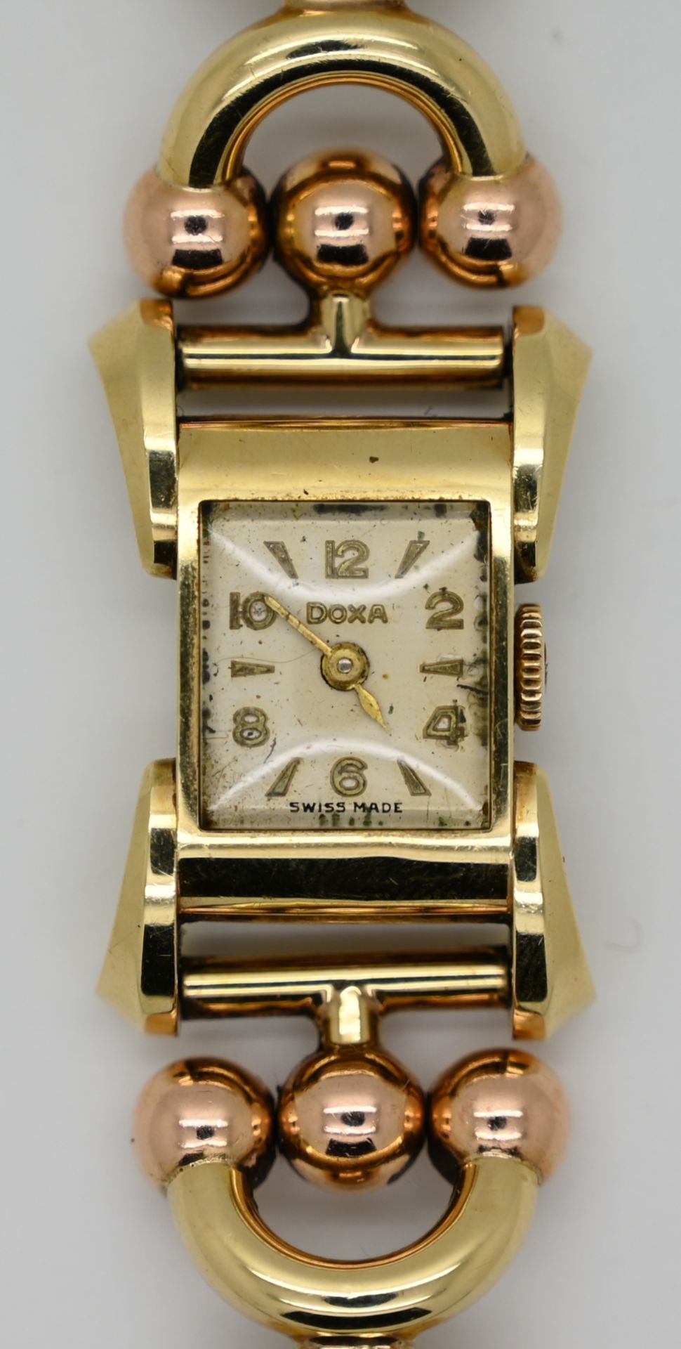 1 Damenarmbanduhr GG 14ct. (Gehäuse) DOXA, Band undeutl. gestempelt wohl GG/RG, wohl Automatik, Uhr