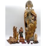 12 Figuren nztl. Holz u.a., z.T. farbig gefasst z.B. "Heilige Elisabeth" ca. H 56cm, "Heilige Famili