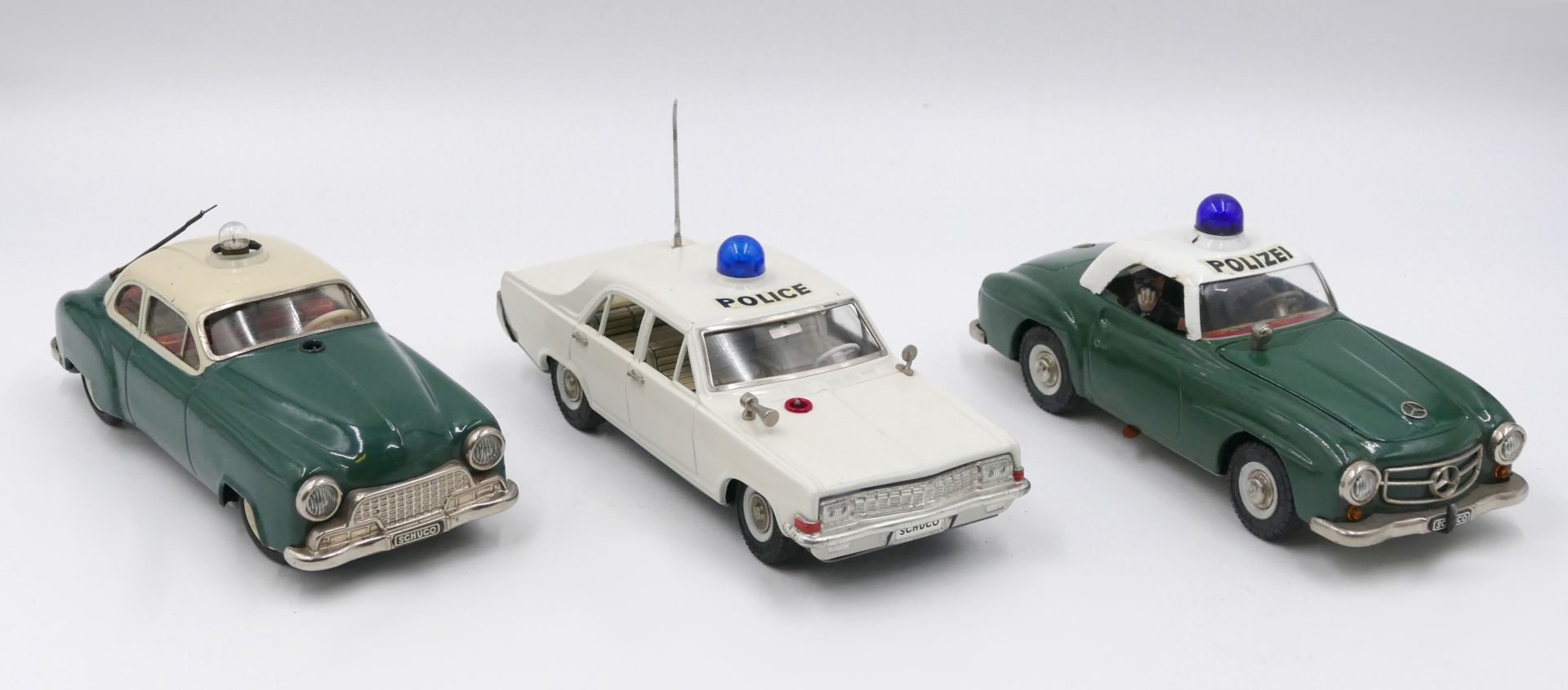 3 Polizeiautos je SCHUCO ELEKTRO je Western Germany: 2x "Alarm-Car 5340" grün und weiß je ca. L 22cm