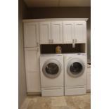 135" x 92" tall white "L" shaped laundry room cabinet with solid surface to
