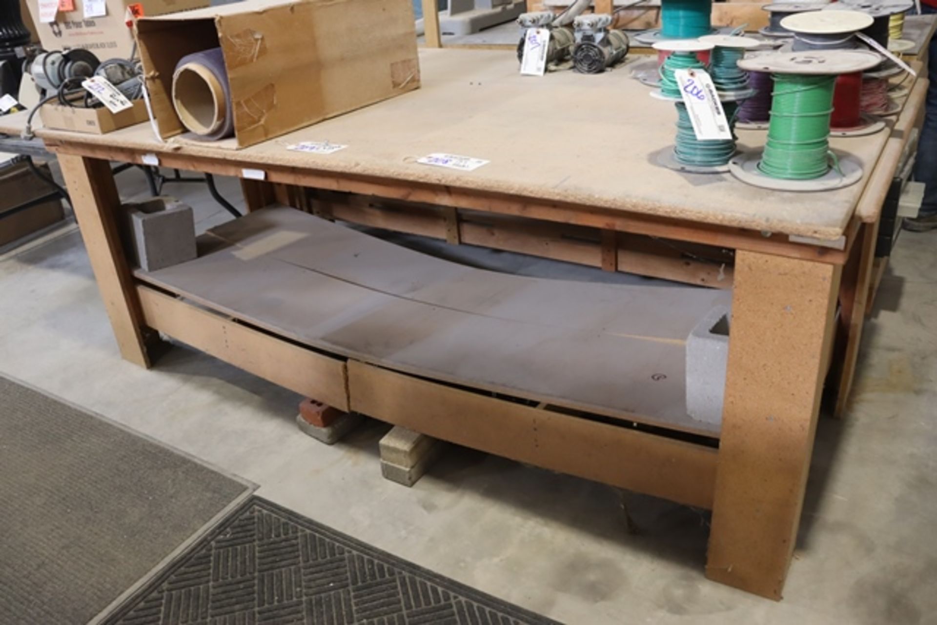 4' x 8' wood framed work table - bottom shelf is busted