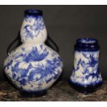 An Arts and Crafts Wileman & Co. 'Faience' two-handled double gourd vase, decorated in blue with