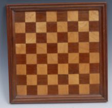 An early 20th century mahogany and parquetry chess board, 29.5cm wide
